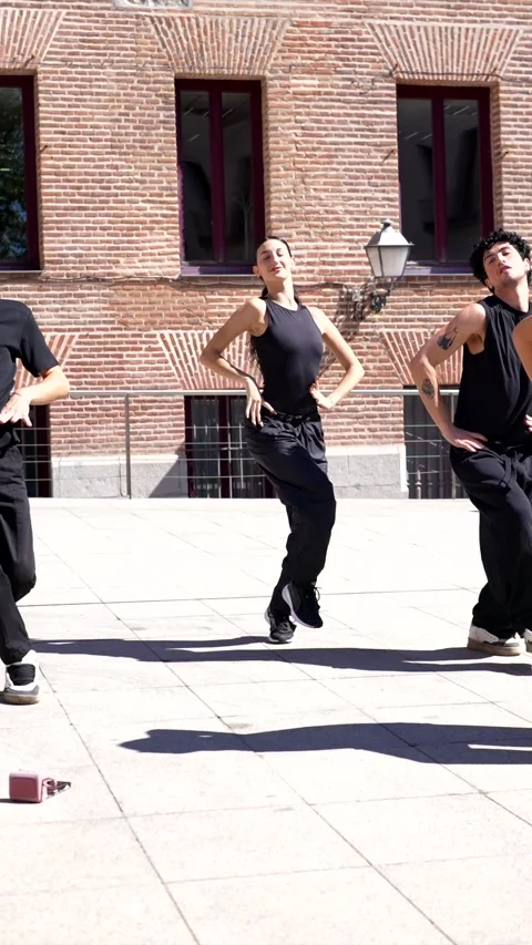 Talented dance crew performing energetic choreography outdoors Stock Footage 318828315