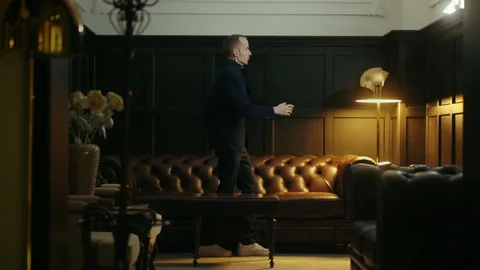 Talented dancer man dancing robot dance in living room, trendy popping and Stock Footage 231218672