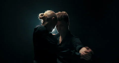 Talented dancers spend time training in a dark studio, practicing new steps 스톡 동영상 161721254
