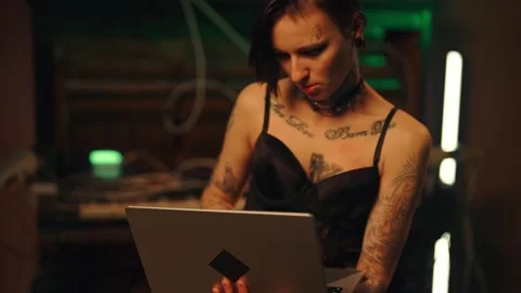 Talented female IT-professional hacking websites by powerful laptop in night Stock Footage 295280602