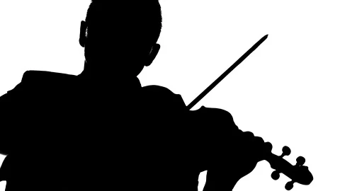 Talented guy plays the classic violin. Medium long shot. Silhouette Stock Footage 134522529