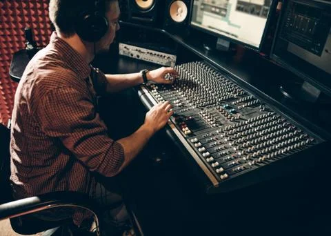 Talented guy working in the music studio. man is creating a hit Stock Photos