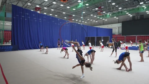 Talented gymnast performs elegant split turn with hoop Vídeo Stock 317148385