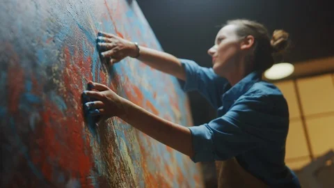 Talented Innovative Female Artist Draws with Her Hands on the Large Canvas Stock Footage