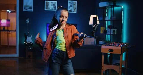 Talented kid using smartphone on selfie stick to film dance tutorial 스톡 사진