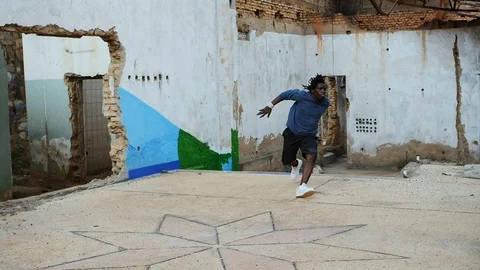 Talented man practicing parkour in the warehouse Stock Footage 117623047