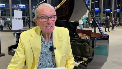 Talented pair on right track for victory in railway station piano competition Video stock 320645269