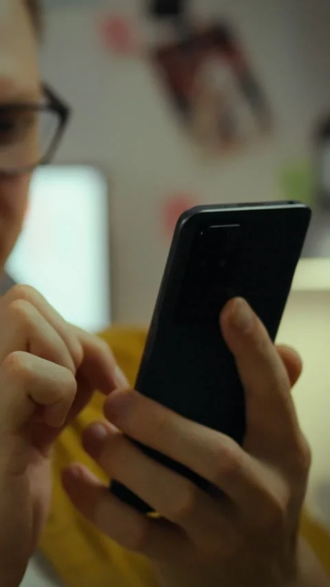 Talented programmer modifies source code for mobile software to enhance func Stock Footage 331729673