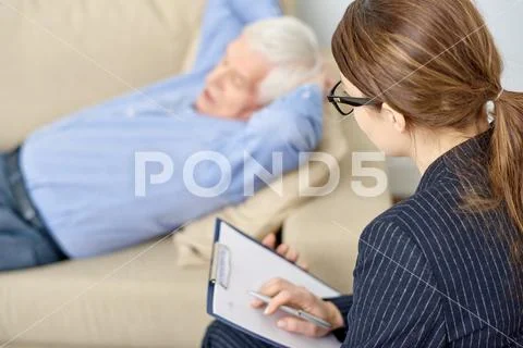 Talented Psychologist Wrapped up in Work Stock Photos