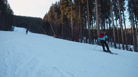 Talented skier rides down extreme downhill slope at winter resort. People skiing Video stock 148981203