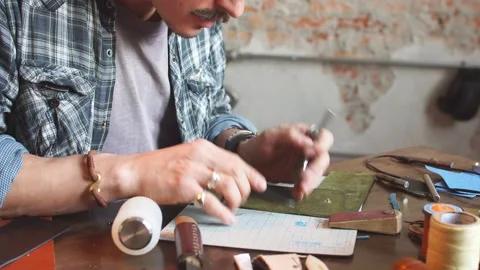 Talented tailor working according the sketch Stock Footage 104236341