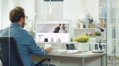Talented Web Designer  Uses Personal Computer to Create Website for Online Store Stock Footage 82787360