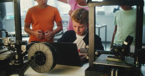 Talented Young Boy Writing Code for Automated 3D Printer on Laptop, Learning Stock Footage 311672883