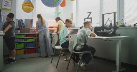 Talented Young Boys Studying Advanced Automated 3D Printer During Programming Stock Footage 314778353
