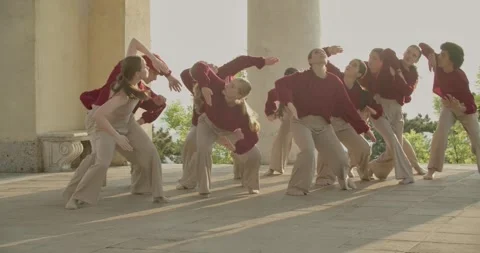 Talented young dancers performing during sunrise, modern choreography, 4k 動画素材 246427003