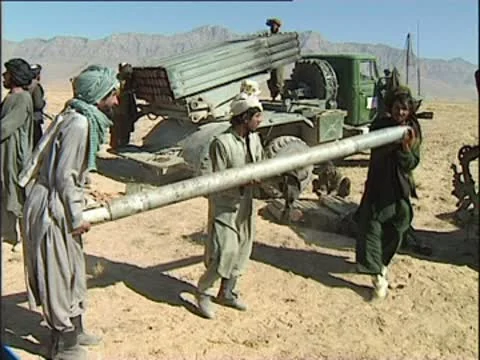 Taliban load ex-Soviet rockets into multiple launcher Stock Footage 10576486