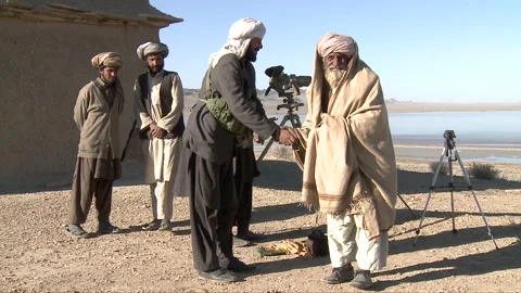 Taliban using old vintage binocular to see their surroundings Stock Footage 202888142