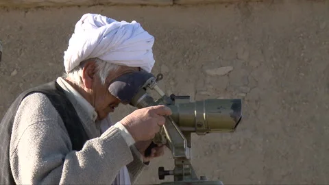 Taliban using old vintage binocular to see their surroundings Stock Footage 202888233