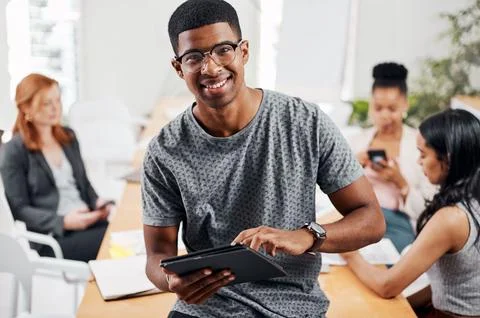 Talk about doing tasks with the most efficiency. Portrait of a young businessman Stock Photos