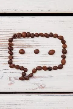 Talk bubble of coffee beans with three grains. 写真素材