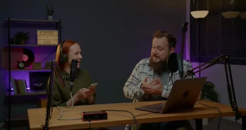 Talk show hosts having a conversation in the studio while recording new episode. Stock Footage 264760962