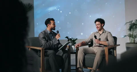 Talk show, men and interview with questions, tablet or conversation with Stock Footage 310824034