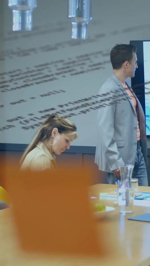 Talk starting, lead pointing to display while scribe writing, code overlay Stock Footage 332747782