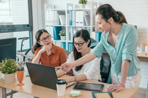 Talking about project together with computer 스톡 사진