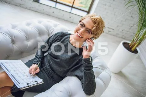Talking advisor smiling at camera Stock Photos
