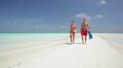 Talking and walking on sandbar Stock Footage 10788362