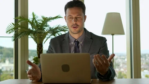 Talking Businessman Working on Computer in Office Stock-Footage 87711815