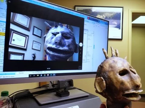 Talking Head Videoconference - office computer with clay figure Stock Photos