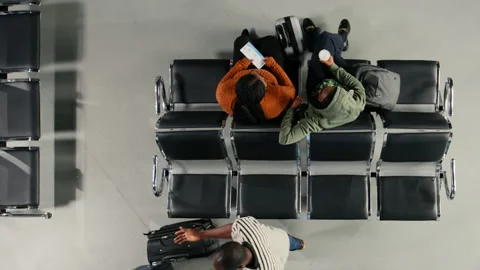 Talking, hectic passenger movement concept and people on airport chairs Stock Footage 333650318