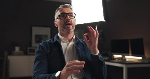 Talking, interview and man on set for recording with documentary, show or movie Stock Footage 303539191