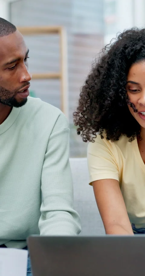 Talking, laptop and couple with documents for finance, online banking or Stock Footage 335892828