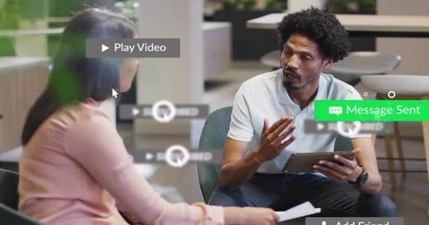 Talking man in polo gesturing with tablet in office lounge, woman holding paper, Stock Photos