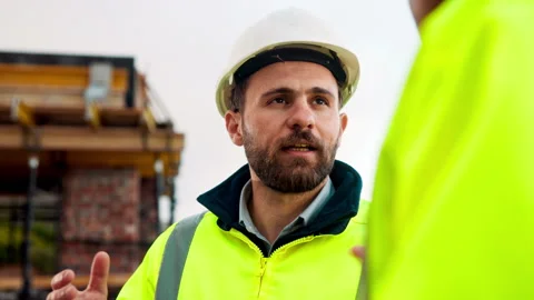 Talking, manager or architect with planning at construction site, engineering Stock Footage 336198648
