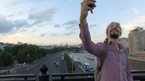 Talking on a mobile. Doing selfie Stock Footage 65330224