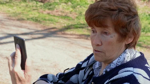 Talking via mobile video app senior woman, agree, disagree Stock Footage 108323366