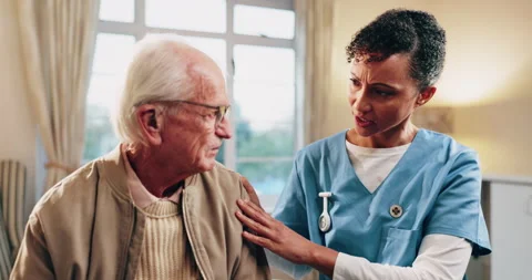 Talking, nurse and chest concern of senior man in home for healthcare, elderly Stock Footage 338373362