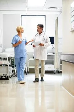 Talking, nurse and folder with people in hospital for medical, consulting and Stock Photos
