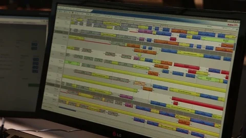 Talking on phone and using computer Stock Footage 77048388