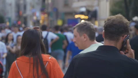 Talking on the phone in the crowd. Stock Footage 213518581