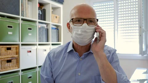 Talking on Phone with Face Mask Stock Footage 128730560