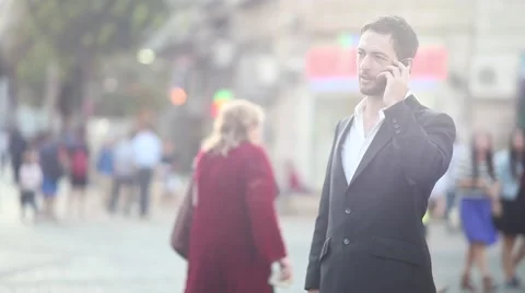 Talking on smartphone [lens flare] Stock Footage 42253889