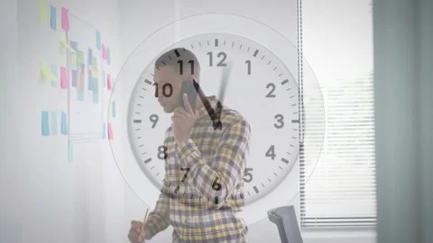 Talking on smartphone, man in office with clock animation overlay Stock Footage 306820091