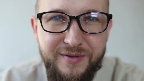 Talking smiling young man with glasses Stock Footage 242720419