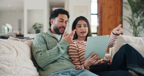 Talking, tablet and couple on sofa for interior design ideas, decoration and Stock Footage 335112055