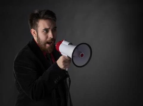 Talking Young Man Using Megaphone Stock Photos