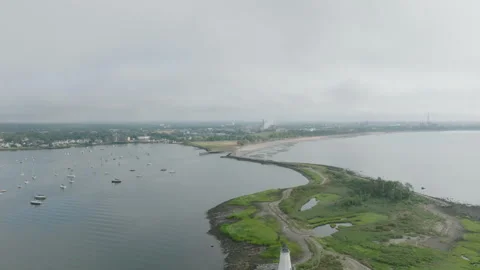 Tall and wide going backwards Drone footage of Black Rock Harbor Lighthouse Stock Footage 341880244